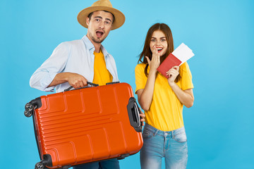 young couple with suitcase