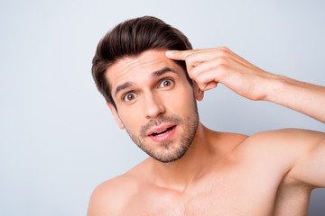 Closeup photo of macho model guy perfect neat hairstyle looking mirror touch forehead worried eyes...
