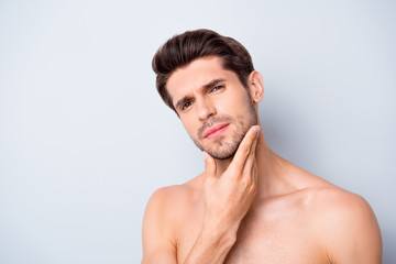 Obraz premium Close up photo of serious mascular guy look mirror touch chin hand expert man skincare spa salon procedure isolated over grey color background