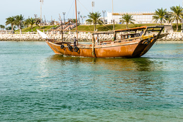 Traditional fishing boat on the coast with ropes