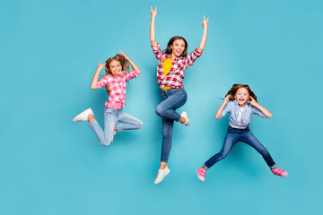 Full length body size photo of funky funny excited trendy family who are rock fans jumping joyfully...