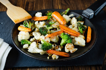 fried vegetables in a pan, vegetarian food, grilled vegetables, fried broccoli cabbage and carrots in a pan
