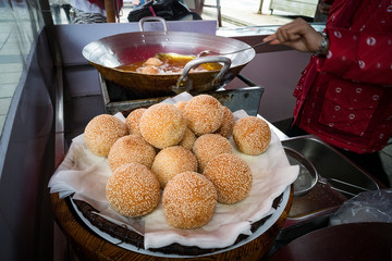 Vietnamese traditional Orange Cake, a fried ball of glutinous rice dough filled with grind sweet...