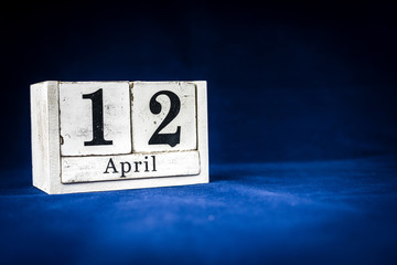 April 12th, Twelfth of April, Day 12 of month April - rustic wooden white calendar blocks on dark...