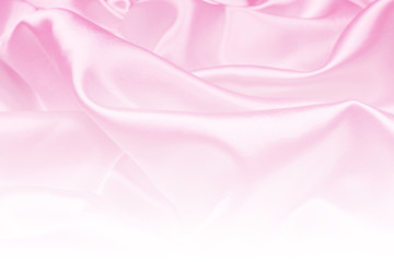 Beautiful pink satin luxury cloth texture can use as wedding background, fabric