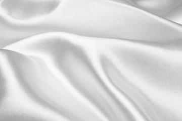 Silver silk texture luxurious satin for abstract background. beautiful white fabric