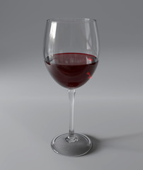 Glass of red whine on gray background