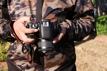 The man is checking the picture he took after learning to take a picture.