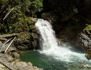 Thundering emerald colored punchbowl waterfall North Fork Sauk River Falls of the north cascades in a rocky gorge off Mountain Loop Highway in Darrington Snohomish county Washington State 