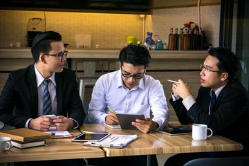 Startup business team on meeting or brainstorming in modern office. working on tablet computer.