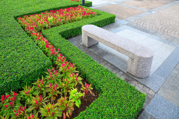 Vertical landscaping and stone seats in the park.