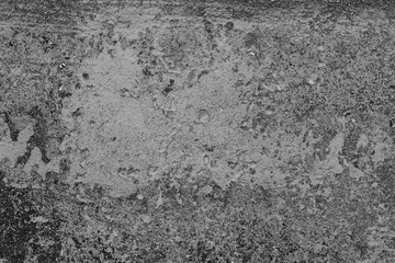 Texture of a concrete wall with cracks and scratches which can be used as a background