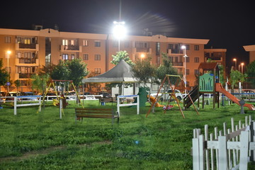 Night Child Playground in the City Illuminated by Lamps