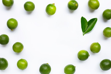Frame made of limes with leaves isolated on white
