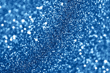 Blue festive background with sparkles in the bokeh. The concept of the celebration, the day of St. Valentine, New Year, birthdays, ceremonies, events, etc.