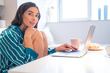 Morning at home with laptop and coffee stock photo