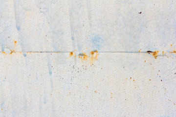 Light blue corroded metal background. Rusty and scratched painted metal wall. Rusty metal...