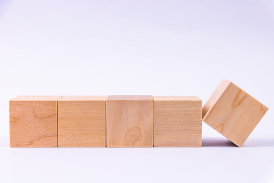 Row of five blank wooden blocks on a white background with copyspace for your text, letters or numbers.