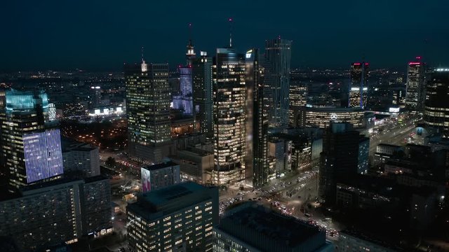 Warsaw Poland. 13. December. 2019. Aerial view of the night city with skyscrapers and busy streets with traffic jams during rush hour.