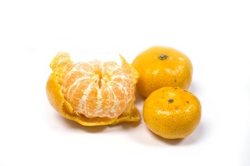 Mandarines, Tangerines or oranges with one peeled on white background.