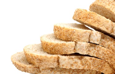 Close up image of cut of loaf whole grain bread isolated on white background