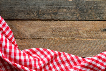 Table cloth on wooden table rustic background. Copy space for text, mock up. High resolution photography ready as a kitchen background.