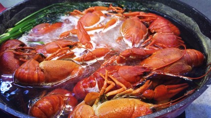 Cooking freshwater crayfish in a pan.