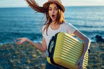 woman with laptop on beach
