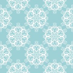 Fototapeta na wymiar Floral seamless pattern. White on blue. Textile background