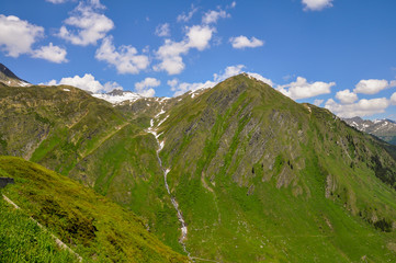 A scenic view of the San Bernardino Pass in Swiss Alps in summer. Mountains in summer.