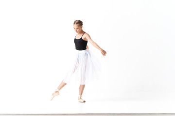 young ballet dancer in action isolated on white