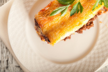 Italian cannelloni pasta on a light table. Flat lay a caneloni pasta dinner close-up and copy space.