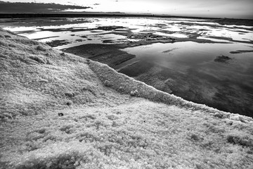 Nature reserve Saline Margherita di Savoia, Apulia, Italy: black and white image of  salt pan at...