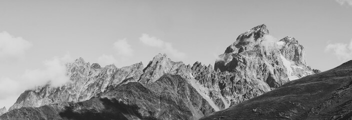 Obraz premium Black and white shot of Panoramic view on Mount Ushba, Main Caucasian ridge. Zemo Svaneti, Georgia. Autumn landscape.