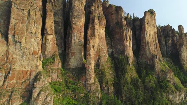Epic aerial climb Lena Pillars Siberia unique miracle of nature high vertical rocks stones sharp peaks. Fairytale natural landscape Russia Yakutsl best sight. National Park World Heritage Reserve 4K