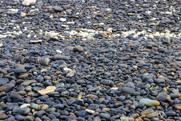 The stones on the ground, as patterns in the beach