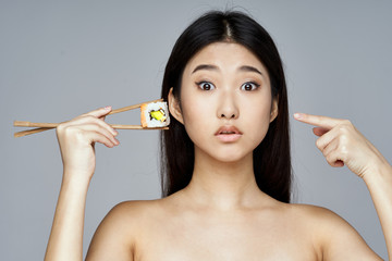 portrait of young woman with makeup brush