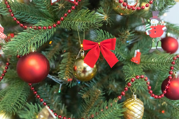 Christmas decoration and celebration. Christmas tree. Xmas red and gold balls. New Year preparations. New Year concept. Christmas tree toys.	