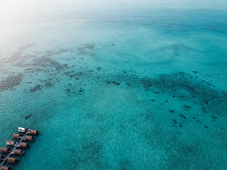 Aerial view of turquoise green sea in Bum Bum Island in Semporna, Sabah, Malaysia.