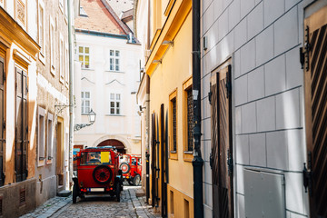 Fototapeta na wymiar Old town street and city tour car in Bratislava, Slovakia