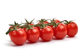 Ripe fresh organic cherry tomatoes, isolated on white background