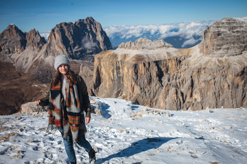Fototapeta premium Young Beautiful Girl on Top of Alpine Mountains