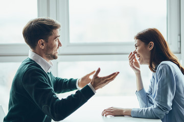 man and woman talking on the phone