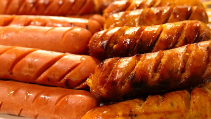 sausages on grill background texture or wallpaper