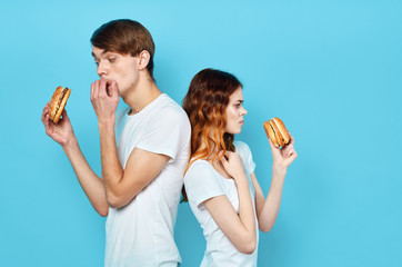 man and woman drinking orange juice