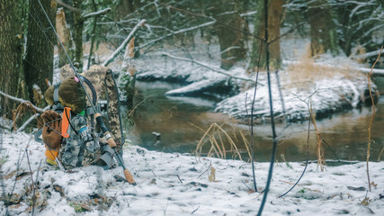 Fishing for autumn trout. Hiking with a backpack.