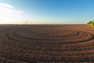 agriculture the land is ploughed to the field / background photo out of the city agriculture