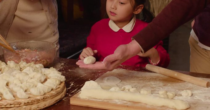 Happy family making dumplings at home,4K