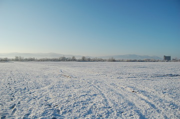 Fototapeta na wymiar winter landscape with snow and blue sky