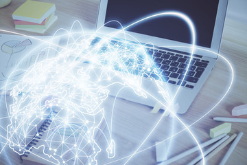 Multi exposure of business theme icons and work space with computer background. Concept of success.
